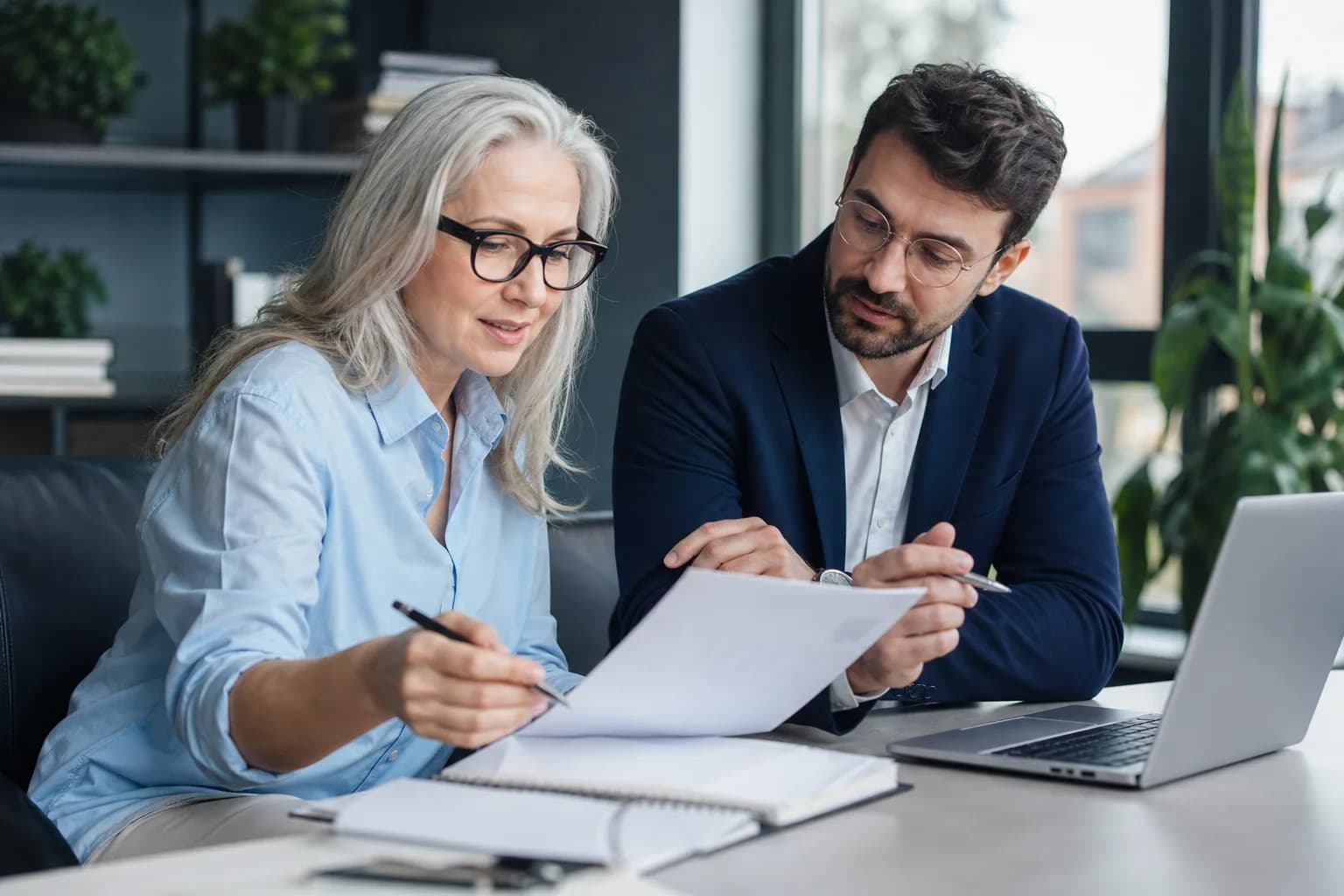 Neighborhood accountant reviewing financial results with a small-business owner